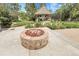 Beautiful backyard featuring a stone fire pit and a charming gazebo, perfect for outdoor entertaining at 7472 S Utica St, Littleton, CO 80128