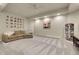 Spacious finished basement with gray carpeting, a comfortable couch, and decorative touches at 7472 S Utica St, Littleton, CO 80128