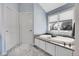 Relaxing bathroom with a soaking tub, granite surround, and natural light from the window at 7472 S Utica St, Littleton, CO 80128
