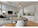 Bright dining area featuring a wooden table, white chairs, and white built-in cabinets at 7472 S Utica St, Littleton, CO 80128
