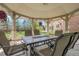 Inviting gazebo interior with comfortable seating and outdoor view, perfect for relaxing and entertaining at 7472 S Utica St, Littleton, CO 80128
