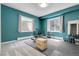 Home gym with blue walls, natural light, and exercise equipment at 7472 S Utica St, Littleton, CO 80128