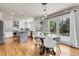 Bright kitchen with white cabinets, stainless steel appliances, granite countertops, and an island at 7472 S Utica St, Littleton, CO 80128