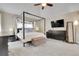 Inviting main bedroom showcasing a four-poster bed, and a light color palette at 7472 S Utica St, Littleton, CO 80128