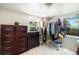 Bright bedroom with natural light from two windows and ample closet space for easy storage at 11940 W Independence Ave, Lakewood, CO 80401