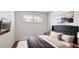 Cozy bedroom with neutral tones, stylish headboard, and ample natural light at 4233 Shoshone St, Denver, CO 80211