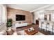 Stylish living room showcasing wood accent wall, modern decor, and open layout to the kitchen at 4233 Shoshone St, Denver, CO 80211