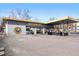 Einstein Bros. Bagels shop exterior with parking and outdoor seating at 751 Eudora St, Denver, CO 80220