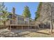 Exterior view of a house with a multi-level deck overlooking the backyard at 8159 Lodgepole Trl, Lone Tree, CO 80124