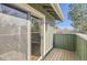 Balcony with wood floors and green siding for outdoor relaxing and enjoyment of natural light at 8159 Lodgepole Trl, Lone Tree, CO 80124