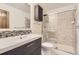 Modern bathroom with mosaic tile backsplash, new vanity, and updated glass shower at 8159 Lodgepole Trl, Lone Tree, CO 80124