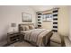 Comfortable bedroom boasts a well-made bed, decorative pillows, and bright natural light at 8159 Lodgepole Trl, Lone Tree, CO 80124