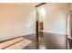 Large bright bedroom featuring high ceilings, hardwood floors, and a doorway leading to the bathroom at 8159 Lodgepole Trl, Lone Tree, CO 80124