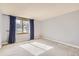 Bright bedroom with carpeting, and a large window with drapes offering natural light at 8159 Lodgepole Trl, Lone Tree, CO 80124