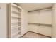Spacious walk-in closet with built-in shelving and hanging rods at 8159 Lodgepole Trl, Lone Tree, CO 80124