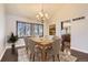 Beautifully staged dining room with neutral tones, decorative lighting, and hardwood floors at 8159 Lodgepole Trl, Lone Tree, CO 80124