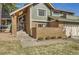 Inviting home with brick facade, complemented by well-maintained landscaping at 8159 Lodgepole Trl, Lone Tree, CO 80124