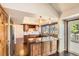 Inviting kitchen featuring granite countertops, wooden cabinets, stainless steel appliances, and an open layout at 8159 Lodgepole Trl, Lone Tree, CO 80124