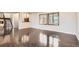 Spacious living room with hardwood floors, staircase, and large windows with blinds offering natural light at 8159 Lodgepole Trl, Lone Tree, CO 80124