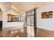 Bright living room with hardwood floors, high ceilings, and sliding glass doors leading to the outside at 8159 Lodgepole Trl, Lone Tree, CO 80124