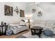 Well-decorated living room with couches, contemporary art, and hardwood flooring at 4301 S Pierce St # 5B, Littleton, CO 80123