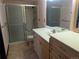 Bathroom with a toilet, sink, vanity, tile floor and shower at 431 S Kalispell Way # 308, Aurora, CO 80017