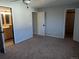 Bedroom featuring ceiling fan and 2 open doors at 431 S Kalispell Way # 308, Aurora, CO 80017