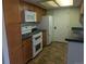 Charming kitchen featuring tile floors, wood cabinets and appliances at 431 S Kalispell Way # 308, Aurora, CO 80017