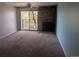 Cozy living room with a fireplace and access to balcony at 431 S Kalispell Way # 308, Aurora, CO 80017