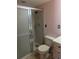 Bathroom featuring shower with glass door, toilet and tile floor at 431 S Kalispell Way # 308, Aurora, CO 80017