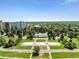 An aerial view showcases a park with an elaborate fountain and colonnade against a skyline backdrop at 789 N Clarkson St # 906, Denver, CO 80218