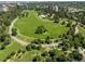 Aerial view of a large park featuring winding sidewalks, a vibrant green lawn, and mature trees at 789 N Clarkson St # 906, Denver, CO 80218