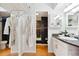 Bathroom featuring a shower, modern fixtures, granite countertop, and white vanity with storage space at 789 N Clarkson St # 906, Denver, CO 80218