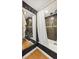 This modern bathroom features tile walls, a bathtub, and a shower curtain at 789 N Clarkson St # 906, Denver, CO 80218