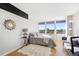 Inviting bedroom with large windows showcasing city views, complemented by a cozy rug and modern decor at 789 N Clarkson St # 906, Denver, CO 80218