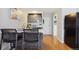 Modern kitchen featuring stainless steel appliances, an island with seating, and sleek cabinetry at 789 N Clarkson St # 906, Denver, CO 80218