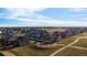 Expansive community featuring well-maintained homes, lush landscaping, and scenic mountain views at 1845 Meagan Way, Erie, CO 80516