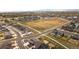 Panoramic aerial view of the residential community with houses, roads, and green spaces at 1845 Meagan Way, Erie, CO 80516