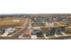 Aerial view of the neighborhood showcasing homes, streets, and nearby open spaces at 1845 Meagan Way, Erie, CO 80516