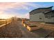 Backyard featuring raised garden beds and a playground, perfect for Gathering activities at 1845 Meagan Way, Erie, CO 80516