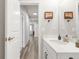 Hall bathroom with quartz countertops and wood vinyl flooring at 1845 Meagan Way, Erie, CO 80516