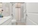 Modern bathroom with shower-tub combination and a decorative vanity mirror at 1845 Meagan Way, Erie, CO 80516