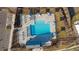 Aerial view of community pool featuring ample lounge seating and shaded areas for residents to enjoy at 1845 Meagan Way, Erie, CO 80516