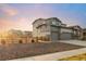 Beautiful two-story home with a two car garage, stone accents, and a landscaped front yard in a quiet neighborhood at 1845 Meagan Way, Erie, CO 80516