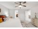 Spacious main bedroom with ceiling fan and access to a walk-in closet at 1845 Meagan Way, Erie, CO 80516