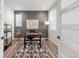 Stylish home office with natural light, a modern desk, and a graphic rug creating a productive workspace at 1845 Meagan Way, Erie, CO 80516