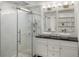 Modern bathroom featuring a spacious walk-in shower and dual vessel sinks at 1499 Blake St # 3M, Denver, CO 80202