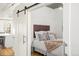 Bedroom with sliding door and modern design at 1499 Blake St # 3M, Denver, CO 80202
