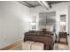Cozy bedroom with plush bedding, side tables, and stylish lamps at 1499 Blake St # 3M, Denver, CO 80202