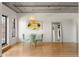Bright dining area featuring hardwood floors and an eye-catching chandelier at 1499 Blake St # 3M, Denver, CO 80202